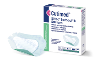 Förpackning av Cutimed Siltec Sorbact B Sacrum med ett förband bredvid